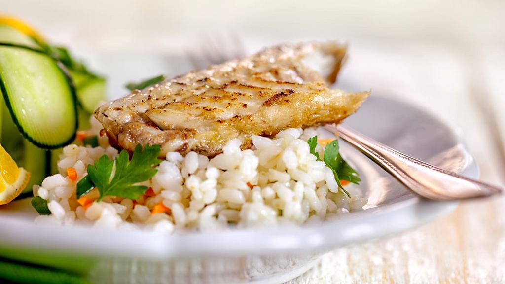 Fried Fish Platter · Halal. Fish served over rice with a side of salad, white sauce, and spicy sauce.