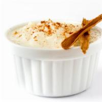 Rice Pudding · Creamy rice pudding prepared with cinnamon, cardamom, and nutmeg.
