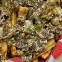 Ribeye Loaded Grub Fries · Chopped Ribeye Steak with onions and peppers topped with Grub Cheese Sauce, plus a choice of...