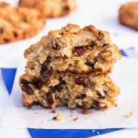 Oatmeal Raisin Cookie · Huge mounds of oatmeal cookie, golden brown on the outside, moist on the inside, are crammed...