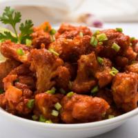 Chili Chicken Dry · Chicken tenders cooked in a soya garlic sauce till crispy.
