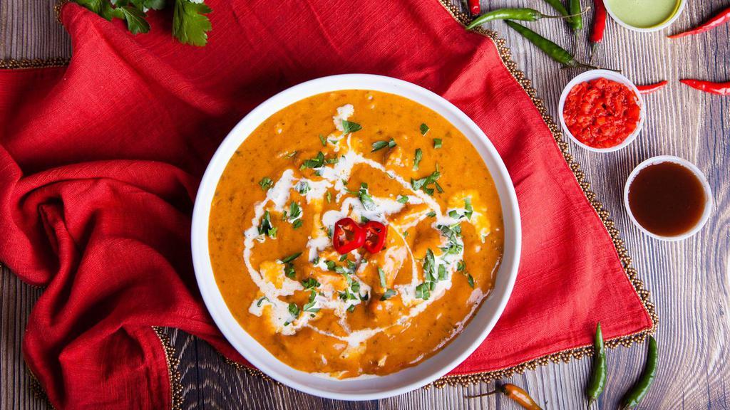 The Spicy Butter Chicken · Spicy! Traditional Indian chicken curry made with marinated boneless chicken in yogurt and a spice blend simmered in a creamy tangy tomato sauce. Served with 8 oz. of Jeera rice.