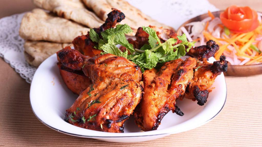 Tandoori Chicken · Fresh chicken marinated in yogurt and mild spices.