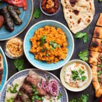 Assortment Sizzler · An assortment of kebabs, chicken tikka, koftas, and tandoori mix.