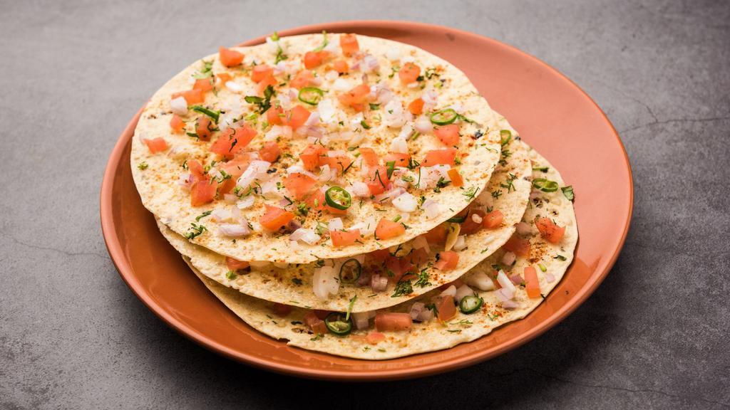 Masala Papad  · A deep-fried cracker topped with chopped onions, chillies, peppers and seasoning.