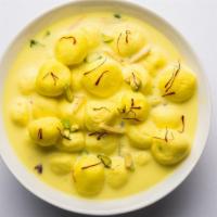 Rasmalai · Sweet cottage cheese dumplings in a saffron and cardamom infused milk.