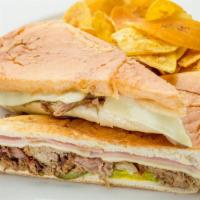 Cubano Sandwich · Served with classic pressed Cuban sandwich of roasted pork, ham, Swiss cheese, pickles and m...