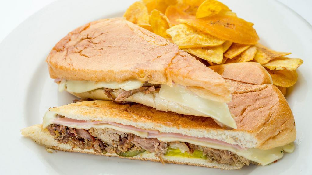 Cubano Sandwich · Served with classic pressed Cuban sandwich of roasted pork, ham, Swiss cheese, pickles and mustard.