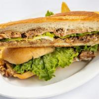 Pernil Sandwich · Made with roasted pork sandwich, lettuce, tomato and mayonnaise.