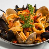 Marinera Paella · Made with Spanish rice, mussels, clams, calamari, bay scallops and shrimp.