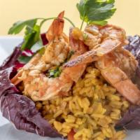 Arroz Con Camarones · Yellow rice with shrimp and vegetables.