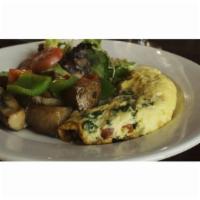 Omelette Florentine · 3 eggs omelet with sautéed spinach, onions, tomatoes. Served with salad and home fries.