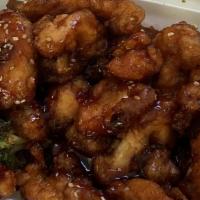 Sesame Chicken · Crispy fried white meat chicken cooked w. a honey sesame sauce