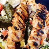 Chicken Soulaki · Sliced Grilled Chicken With Chopped Lettuce, Tomato, and Onions.  Tzatziki Sauce