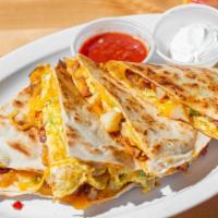 Breakfast Quesadilla · Eggs, potatoes, peppers, cheese, bacon, salsa & sour cream