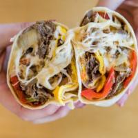 Philly Steak & Egg Wrap · 3 eggs, Philly steak, grilled onions, peppers & American cheese in a wrap