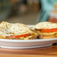 Avo Toast · 2 eggs one easy, avocado & tomatoes on rye toast
