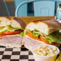 Italian Hero · Genoa salami, deluxe ham, provolone, lettuce, tomatoes & oil & vinegar