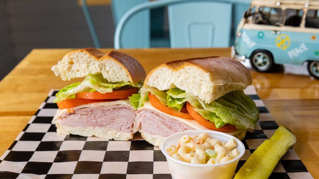 Italian Hero · Genoa salami, deluxe ham, provolone, lettuce, tomatoes & oil & vinegar