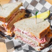 Sloppy Joe · Roast beef, turkey & Swiss with coleslaw & Thousand Island dressing on rye