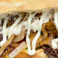 Hot Roast Beef Sandwich · Cheddar cheese, sautéed onions, lettuce, tomatoes & horseradish dressing on a roll