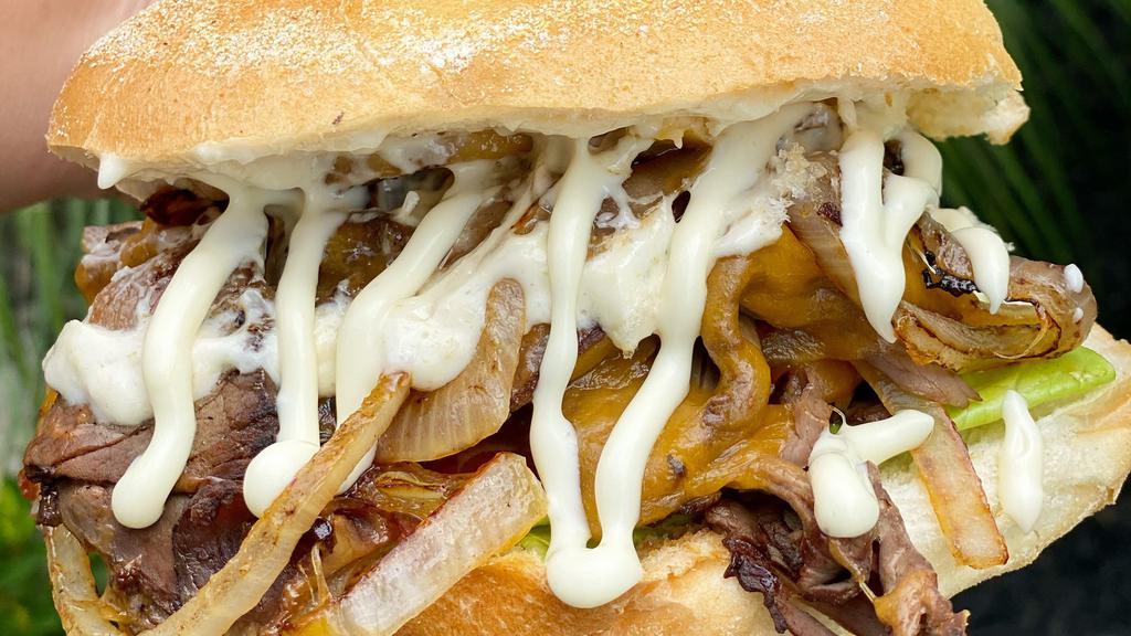 Hot Roast Beef Sandwich · Cheddar cheese, sautéed onions, lettuce, tomatoes & horseradish dressing on a roll