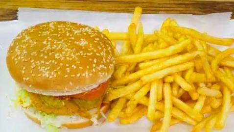 Chicken Sandwich Deluxe · Served with french fries and can of soda.