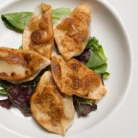 Pan Fried Dumplings · Choice of filling folded into fresh dumpling then pan fried to perfection, served with a bas...