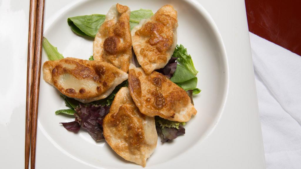 Pan Fried Dumplings · Choice of filling folded into fresh dumpling then pan fried to perfection, served with a basil garlic dipping sauce.