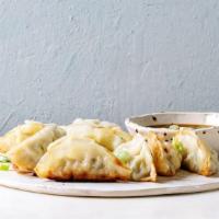 Steamed Dumplings · Choice of filling folded into fresh dumpling then steamed to perfection, served with a basil...