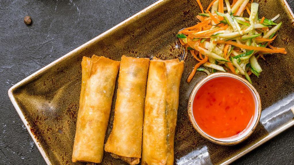 Vegetable Spring Rolls (3 Pcs) · Crispy rolls filled with tender bamboo shoots, cabbage, carrots and bean thread, served with a plum dipping sauce.