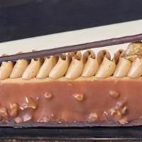 Hazelnut Mousse Finger Pastry · Hazelnut mousse dipped in crunchy hazelnut wafer chocolate set atop a buttery chocolate sabl...