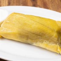 Tamal De Elote · Fresh corn tamale with sour cream or cheese.