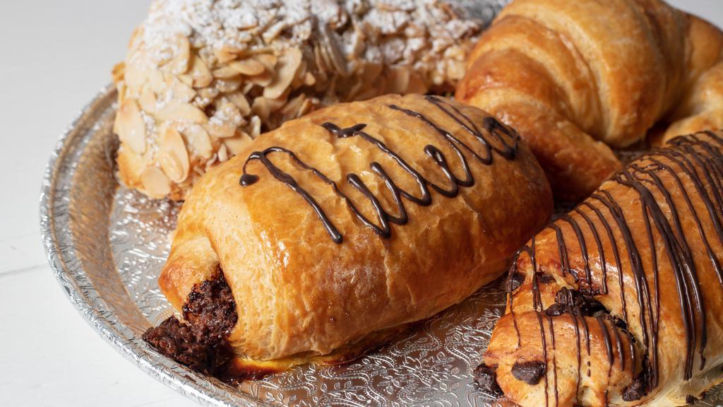 Croissants · the best buttery flaky croissants, with a variety of flavors including almond, chocolate, nutella, and plain