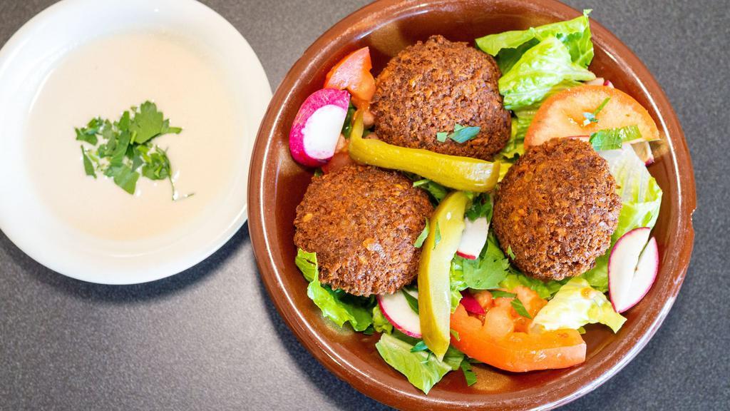 Falafel Mazza · Vegetable patties. Chickpea and fava bean mixed with herbs and exotic spices fried golden brown. Topped with diced tomato, parsley, radish and tahini sauce.