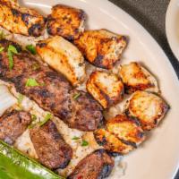Kabob Combination · Choice of any three skewers. Served with pita breads, hummus, rice pilaf and house salad wit...