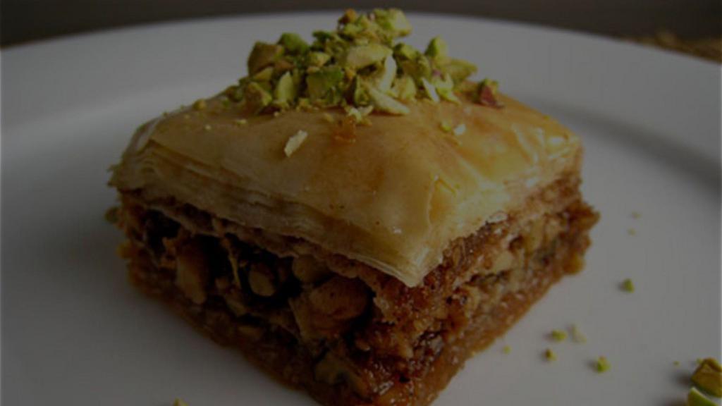 Walnut Baklava · Baklava, from the Farsi for many leaves, is a pastry perfected by royal bakers, consisting of layers of phyllo filled with nuts, cheese, or fruit and spices, and drenched in a honey-based syrup.