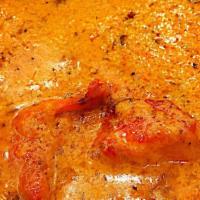 Chicken Tikka Masala · Boneless tandoori chicken pieces cooked in tomato and onion cream sauce. Served with basmati...