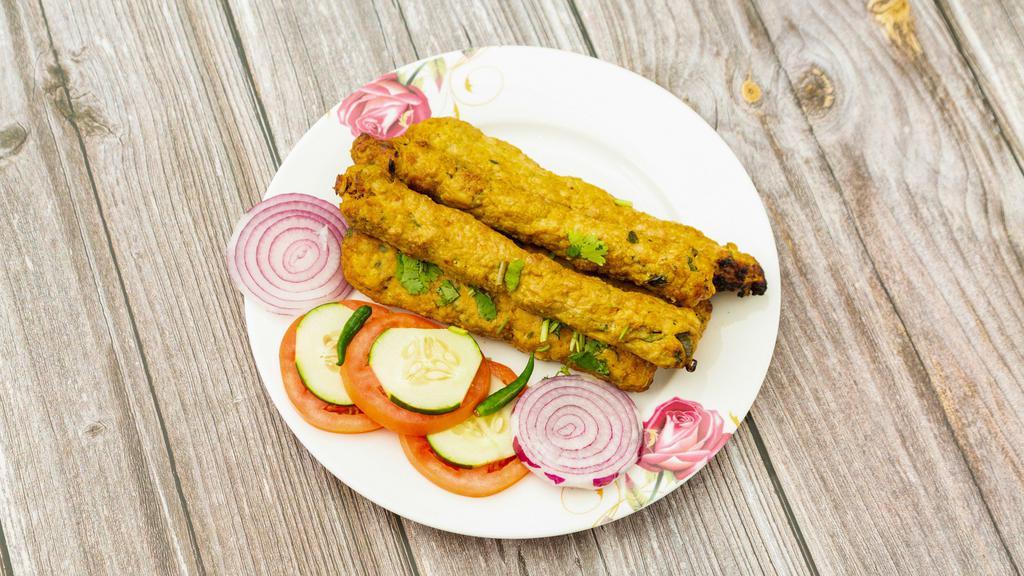Chicken Seekh Kabab (02 Pcs) · Two pieces of ground chicken seasoned with herbs, cooked in a tandoori oven. Served with one naan bread and salad.