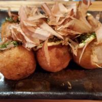 Takoyaki · Crispy octopus dumpling with mayo, sweet sauce, bonito flakes on top