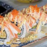 Sake Roll · Salmon tempura, avocado inside, crab on top with spicy mayo and eel sauce.