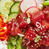 Tuna Or Salmon Poke · Tuna or salmon, onion, diced tomato, cucumber, avocado, edamame or seaweed salad, topped wit...