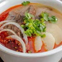 Herbal Beef Soup · Fragrant and hearty bone broth, served with tender slices of beef shin and daikon.