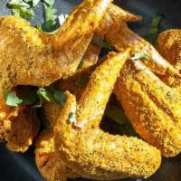 Curry Lemon Dry Rub Wings · Tangy, mouthwatering and completely addictive, our signature Lemon Curry Wings are a must tr...