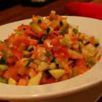 House Chopped Salad · Diced carrots, cucumbers, roasted peppers, sweet red onions, tomatoes, crispy bacon, gorgonz...