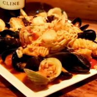 Seafood Linguini Dinner · Shrimp, scallops, littleneck clams and mussels, in herbal white wine tomato broth.