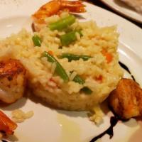 Risotto Dinner · Shrimp and scallops served over saffron risotto, peas and roasted sweet peppers.