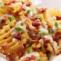 Loaded Fries · 3 chef’s cheese blend, pico de gallo, pickled jalapenos, and smoked crispy bacon, sour cream.