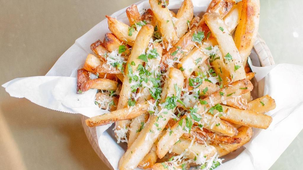 Truffle Fries · Ultimate crispy fries tossed with withe truffle oil, 5 months aged Parmesan cheese, and parsley.