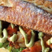 Grilled Shrimp And Avocado Sandwich · Marinated wild gulf shrimp, smoked crispy bacon, organic avocado, arugula, pickles, sriracha...